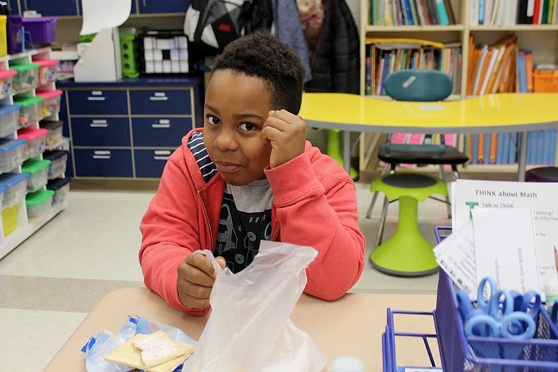 Student eats breakfast in the classroom 